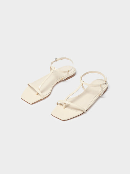 Aeyde | Artis Leather T-Bar Sandals Leather Flat Sandals for Women | Creamy Polido | Square Toe | Flat Heel | On Feet